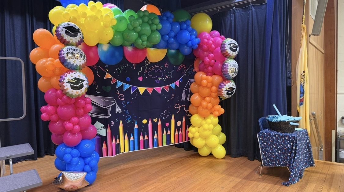 Rainbow organic balloon arch for a graduation